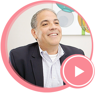A man smiling as he talks about his experience as a patient at Maria Cardenas DMD.