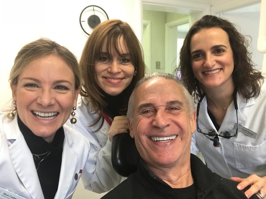 Maria Cardenas' team with happy patient