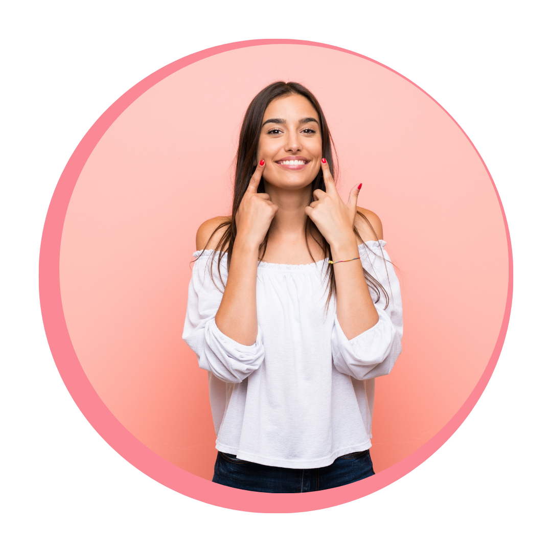 Person pointing at their smile