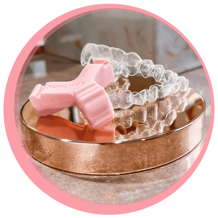 pink ortho munchie with invisalign clear aligners